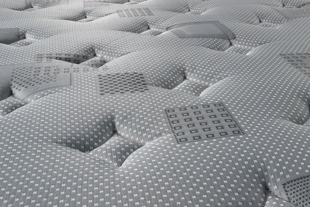 Détail réel du tissu Harmony Charcoal et de la finition du matelas Essentiel